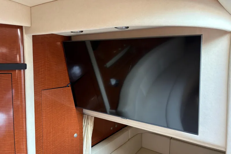  Yacht Photos Pics Interior of 2005 Sea Ray 340 Sundancer with mounted flat-screen TV.