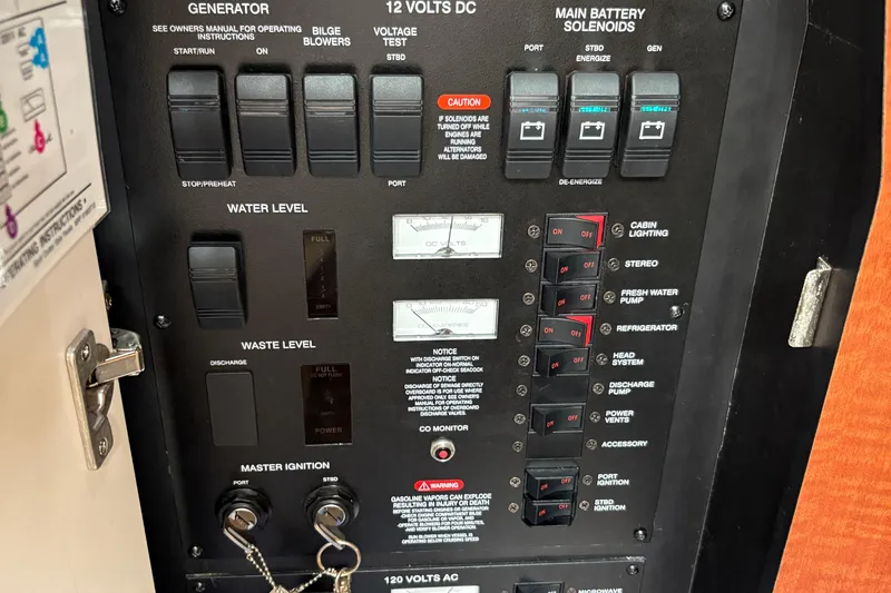 Yacht Photos Pics Control panel of a 2005 Sea Ray 340 Sundancer boat, showing switches and gauges.