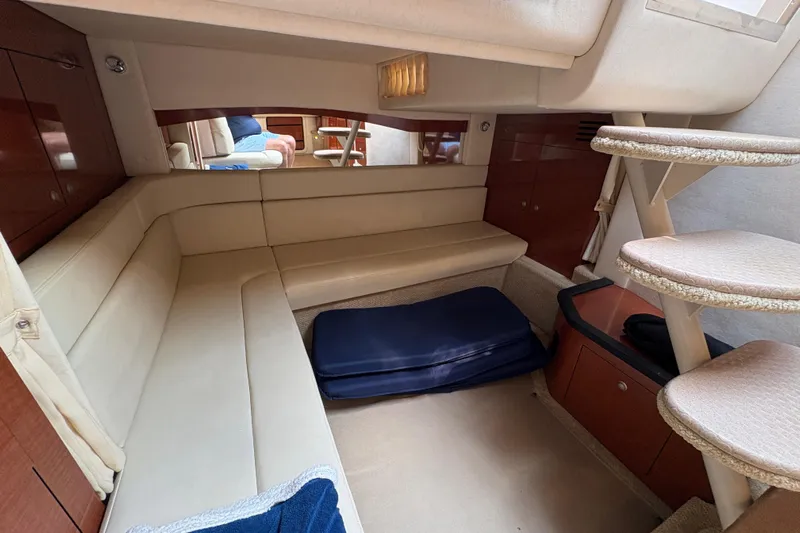  Yacht Photos Pics Interior of 2005 Sea Ray 340 Sundancer yacht, featuring cozy seating and elegant design.