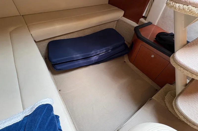  Yacht Photos Pics Interior cabin of 2005 Sea Ray 340 Sundancer with seating and storage.