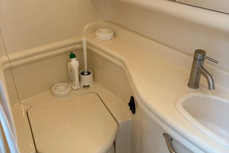  Yacht Photos Pics Bathroom of 2005 Sea Ray 340 Sundancer yacht with toilet and sink.