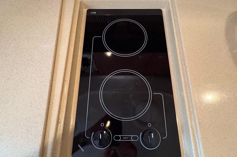  Yacht Photos Pics Stovetop on 2005 Sea Ray 340 Sundancer yacht, featuring two burners and sleek design.