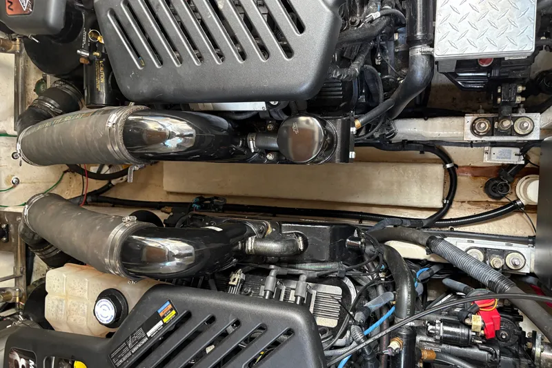  Yacht Photos Pics Engine compartment of a 2005 Sea Ray 340 Sundancer boat, showcasing mechanical components.