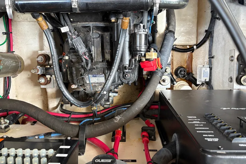  Yacht Photos Pics Engine compartment of a 2005 Sea Ray 340 Sundancer boat, showing wiring and components.