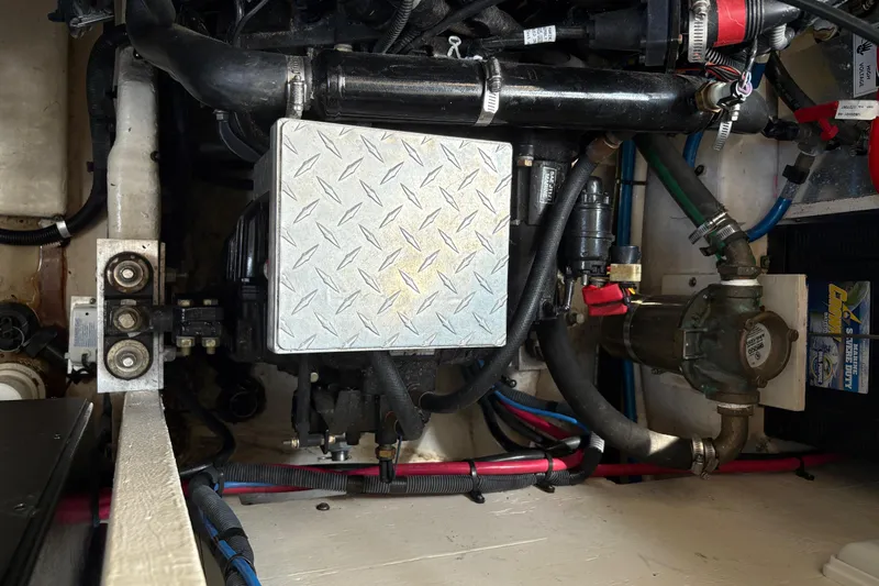  Yacht Photos Pics Engine compartment of a 2005 Sea Ray 340 Sundancer boat, showing mechanical components.