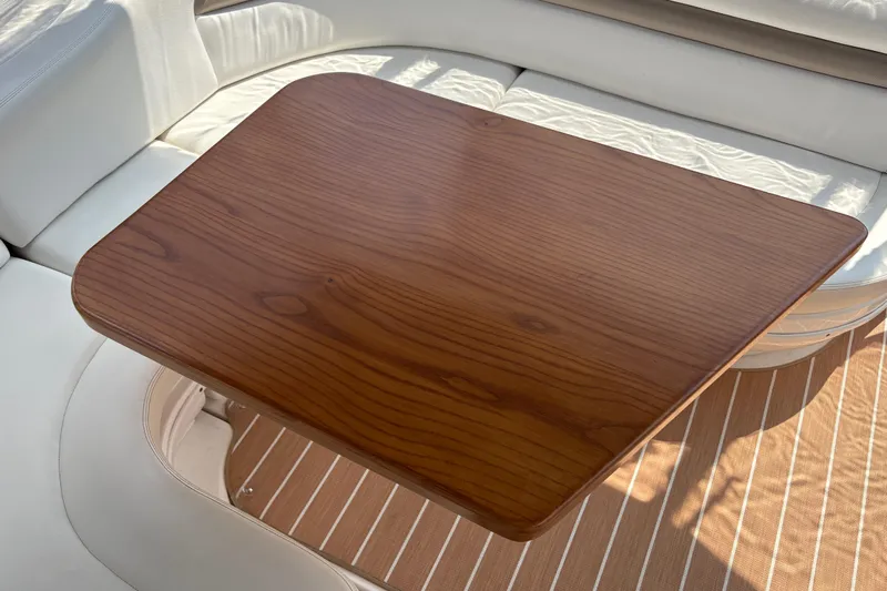  Yacht Photos Pics Wooden table on 2005 Sea Ray 340 Sundancer yacht with white seating.