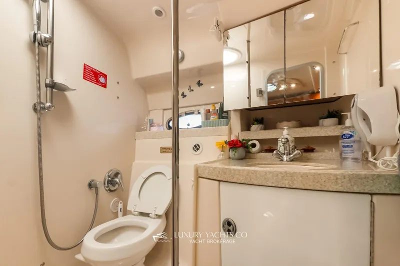  Yacht Photos Pics Luxurious bathroom in 2007 Regal Commodore 3760 IB yacht with modern amenities.