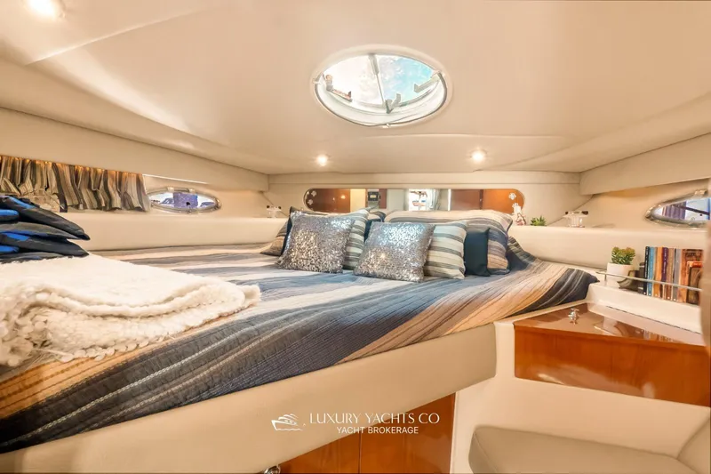  Yacht Photos Pics Luxurious interior of 2007 Regal Commodore 3760 IB yacht with cozy bedding and elegant decor.