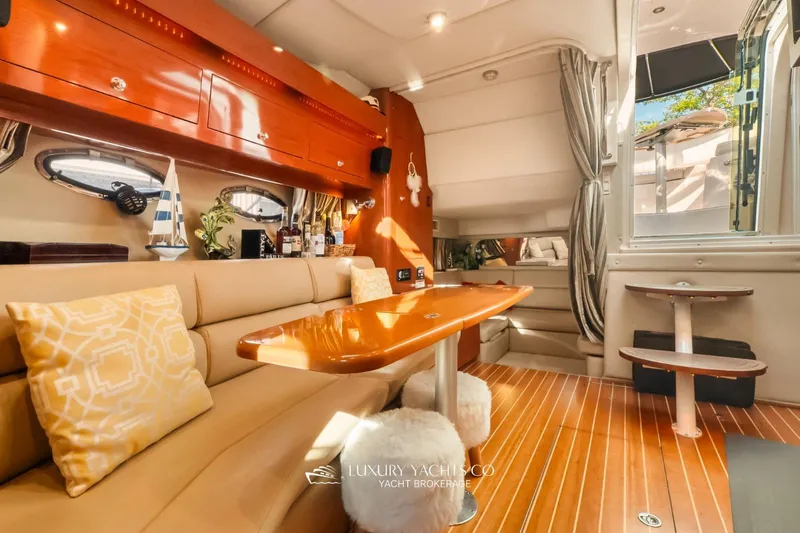  Yacht Photos Pics Luxurious interior of 2007 Regal Commodore 3760 IB yacht with elegant seating and wooden finishes.