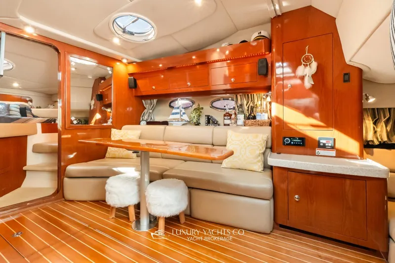  Yacht Photos Pics Luxurious 2007 Regal Commodore 3760 IB yacht interior with elegant seating and wooden finishes.