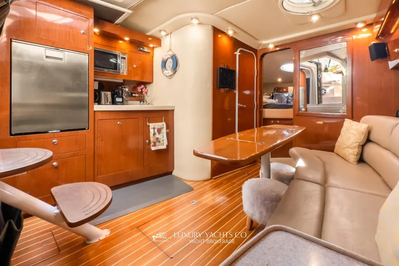  Yacht Photos Pics Luxurious interior of 2007 Regal Commodore 3760 IB yacht with modern kitchen and seating area.