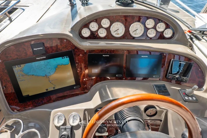  Yacht Photos Pics 2007 Regal Commodore 3760 IB yacht dashboard with navigation screens and gauges.