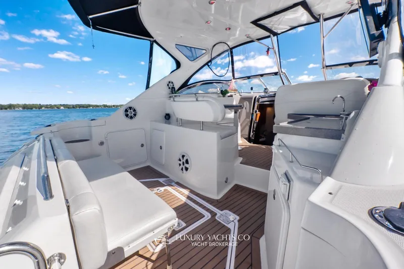  Yacht Photos Pics 2007 Regal Commodore 3760 IB yacht interior with seating and helm, on a sunny day.