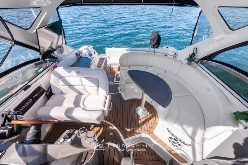  Yacht Photos Pics Luxurious 2007 Regal Commodore 3760 IB yacht interior with elegant seating and wooden flooring.