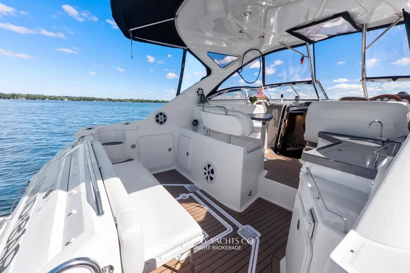  Yacht Photos Pics 2007 Regal Commodore 3760 IB yacht interior with seating, sink, and open water view.
