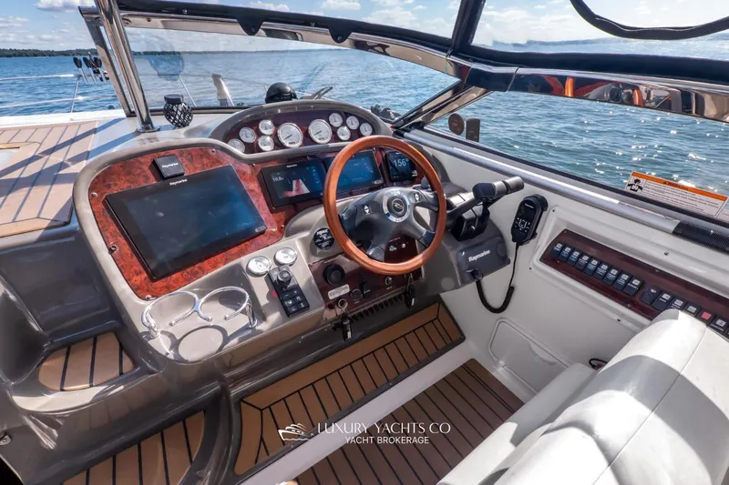  Yacht Photos Pics 2007 Regal Commodore 3760 IB yacht cockpit with modern navigation controls and wood accents.