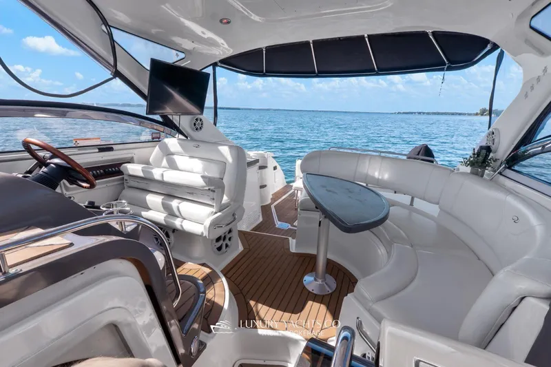  Yacht Photos Pics 2007 Regal Commodore 3760 IB yacht interior with seating, table, and ocean view.