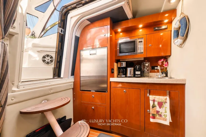  Yacht Photos Pics Luxurious 2007 Regal Commodore 3760 IB yacht interior with kitchenette and modern amenities.