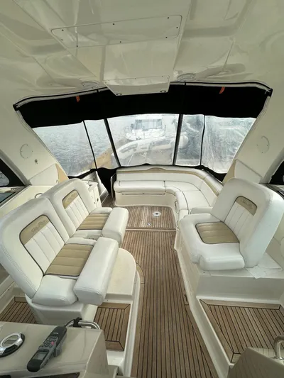 Pendragon Yacht Photos Pics Interior of 2009 Sea Ray 350 Sundancer yacht with plush seating and wood flooring.