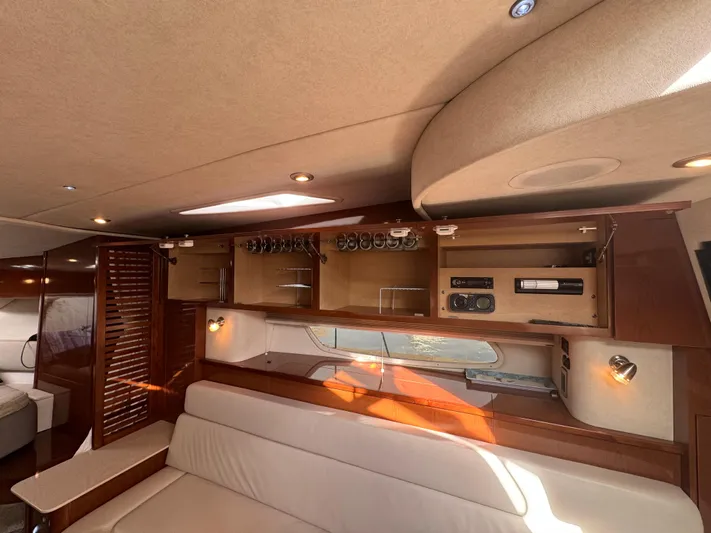 Pendragon Yacht Photos Pics Interior of 2009 Sea Ray 350 Sundancer yacht with elegant wood cabinetry and seating.
