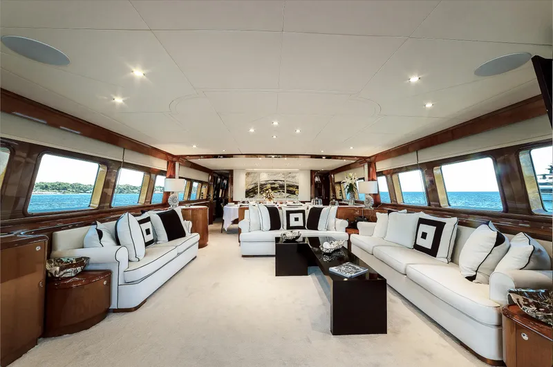 Theion Yacht Photos Pics Luxurious interior of 1997 Baglietto 31m yacht with elegant seating and ocean views.