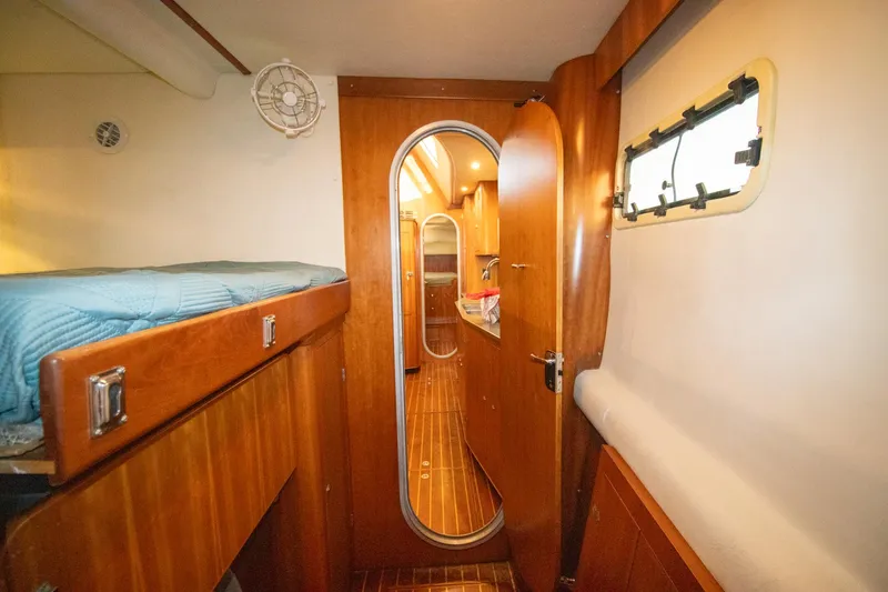 Amazing Grace Yacht Photos Pics Interior of 2004 Antares PDQ 44 yacht with wooden finishes and cozy cabin.