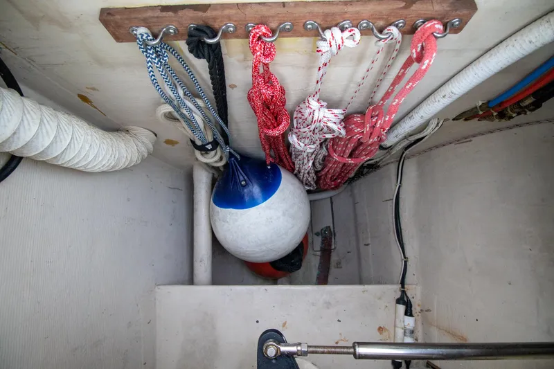 Amazing Grace Yacht Photos Pics Storage compartment with ropes and buoy on Antares PDQ 44, 2004 model.