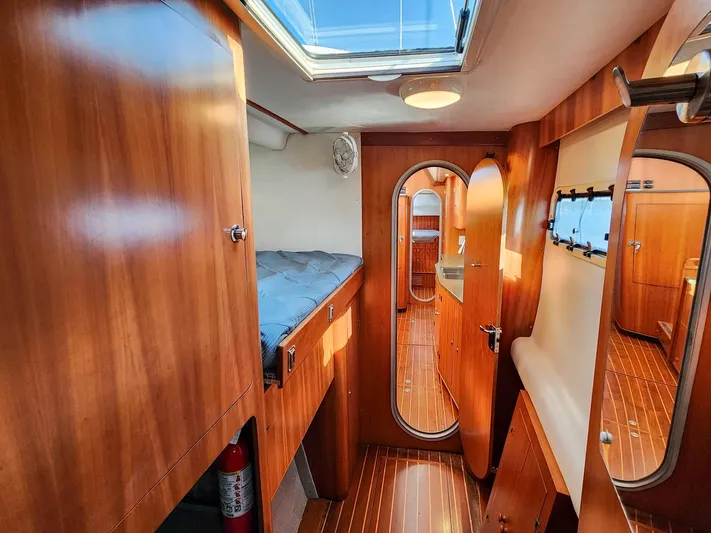Amazing Grace Yacht Photos Pics Luxurious wooden interior of 2004 Antares PDQ 44 yacht cabin with skylight.