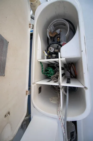 Amazing Grace Yacht Photos Pics Storage compartment on a 2004 Antares PDQ 44 boat, containing ropes and equipment.