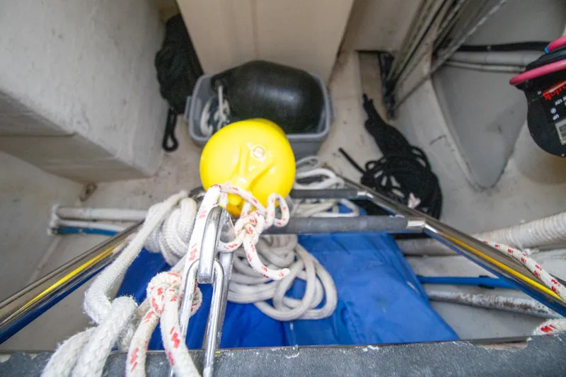 Amazing Grace Yacht Photos Pics Storage area on 2004 Antares PDQ 44 with ropes, yellow buoy, and equipment.
