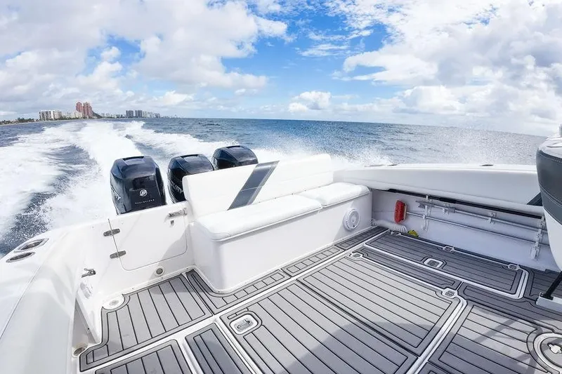  Yacht Photos Pics 2008 Donzi 38 ZSF boat cruising on open water under a bright blue sky.