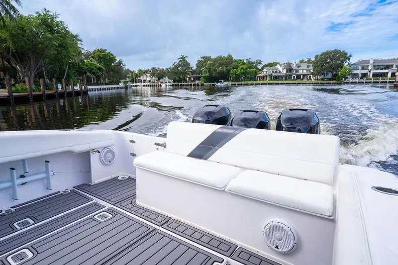  Yacht Photos Pics 2008 Donzi 38 ZSF boat cruising on a scenic waterway with lush greenery.