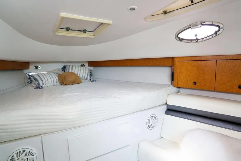  Yacht Photos Pics Interior cabin of 2008 Donzi 38 ZSF boat with bed and storage cabinets.