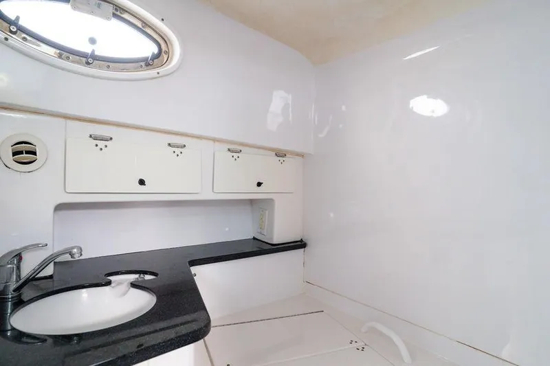  Yacht Photos Pics 2008 Donzi 38 ZSF boat interior with sink and storage cabinets.