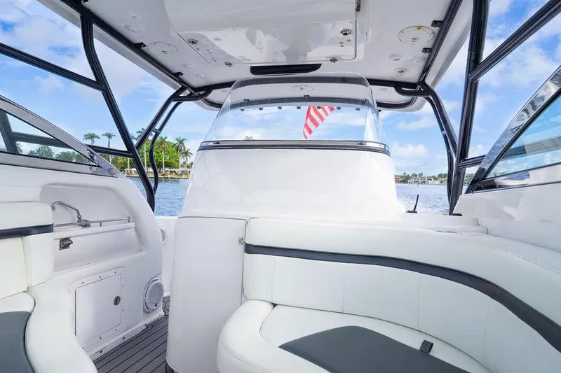  Yacht Photos Pics 2008 Donzi 38 ZSF boat interior with white seating and American flag in background.