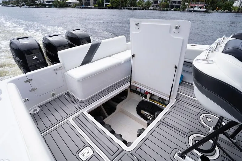  Yacht Photos Pics 2008 Donzi 38 ZSF boat with open hatch, triple Mercury engines, and sleek deck design.