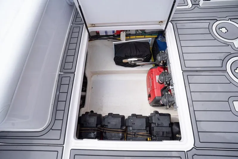  Yacht Photos Pics 2008 Donzi 38 ZSF boat storage compartment with equipment and batteries.