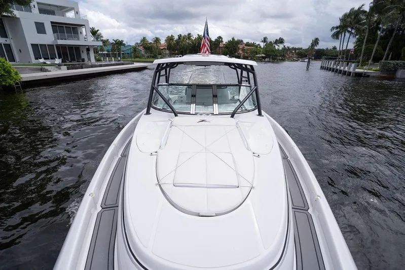  Yacht Photos Pics 2008 Donzi 38 ZSF boat cruising on a scenic waterway with modern homes.