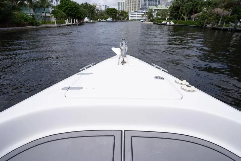  Yacht Photos Pics Bow view of 2008 Donzi 38 ZSF boat navigating a calm waterway.