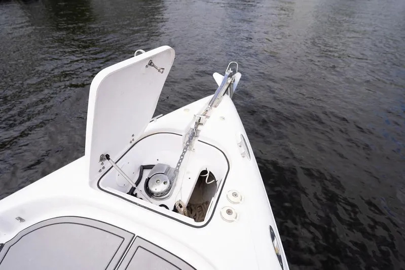 Yacht Photos Pics 2008 Donzi 38 ZSF boat anchor compartment open on calm water.