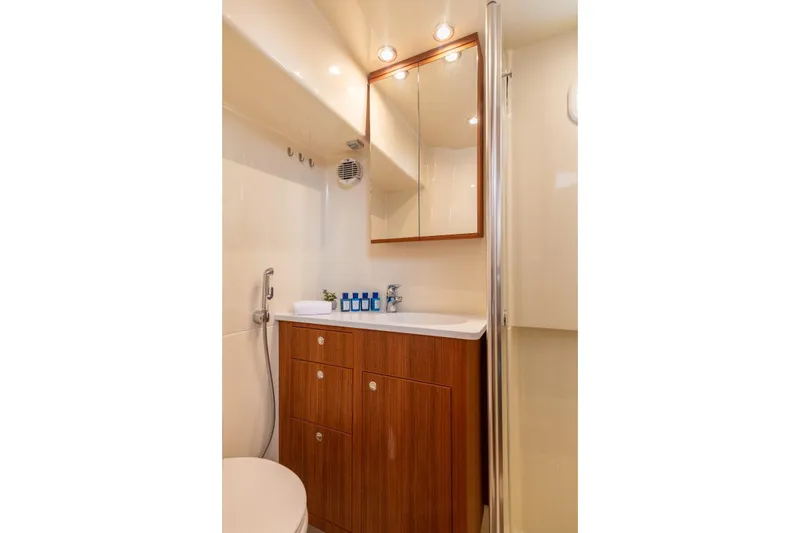 Gala Yacht Photos Pics Luxurious bathroom in 2019 Targa 46 yacht with wooden cabinetry and modern fixtures.
