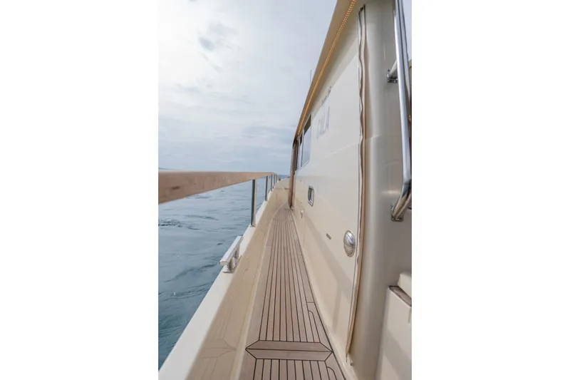 Gala Yacht Photos Pics Side view of 2019 Targa 46 yacht deck with ocean backdrop.