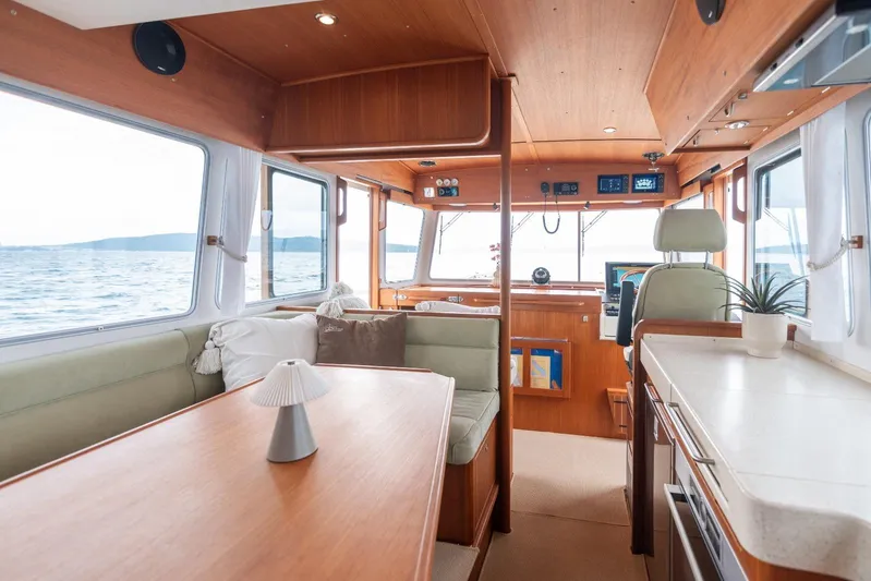 Gala Yacht Photos Pics Interior of 2019 Targa 46 boat with wooden finishes and ocean view.