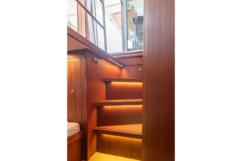 Gala Yacht Photos Pics Wooden interior stairs with ambient lighting on a 2019 Targa 46 yacht.