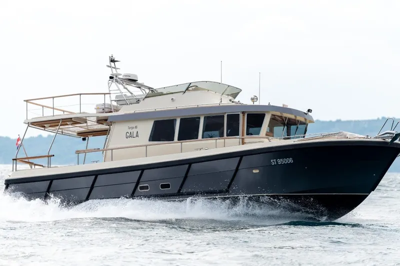 Gala Yacht Photos Pics 2019 Targa 46 yacht cruising on open water, showcasing sleek design and performance.