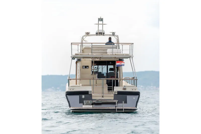 Gala Yacht Photos Pics 2019 Targa 46 yacht on open water, rear view with Croatian flag.