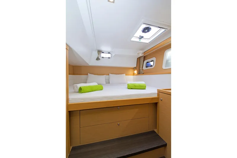 K3 Yacht Photos Pics Cozy cabin interior of 2019 Lagoon 50 yacht with bed and skylight.