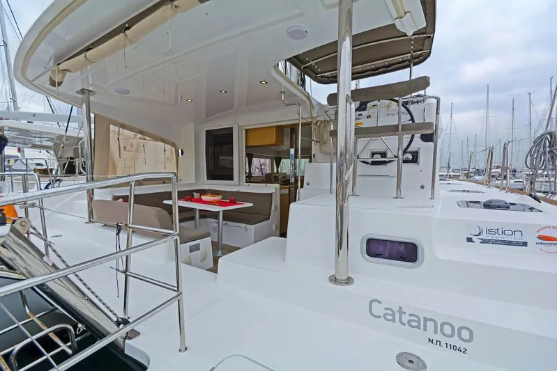 K3 Yacht Photos Pics 2019 Lagoon 50 catamaran with outdoor seating and helm, docked at marina.