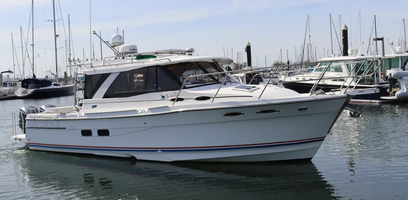 The Islander Yacht Photos Pics 2018 Cutwater C-302 Coupe boat docked in a marina.