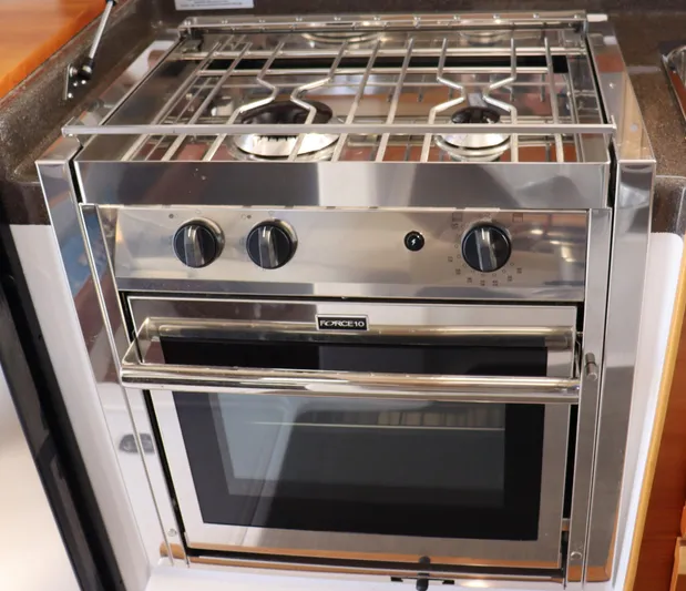 The Islander Yacht Photos Pics Stainless steel stove and oven in 2018 Cutwater C-302 Coupe boat kitchen.